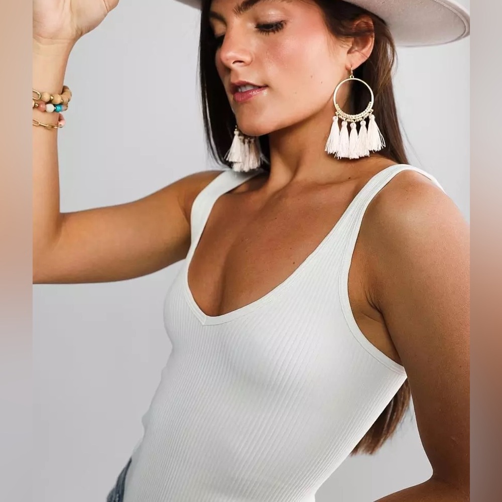 Free People XYZ ribbed Bodysuit in white.  New with tags, size M/L.